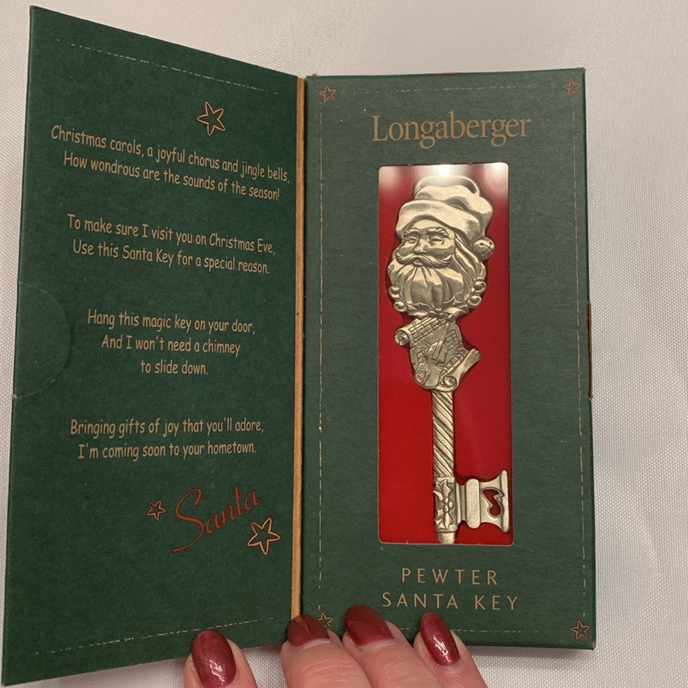 Longaberger Pewter Santa Key from 2003. It has not been used.